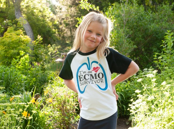 Young girl posing in greenery