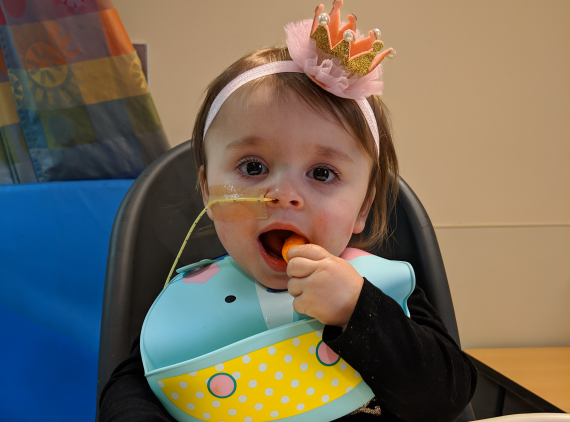 Child with NG tube, feeding herself