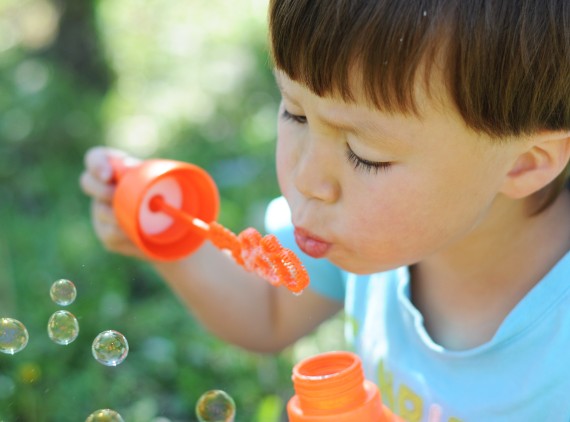 Child blowing bubbles