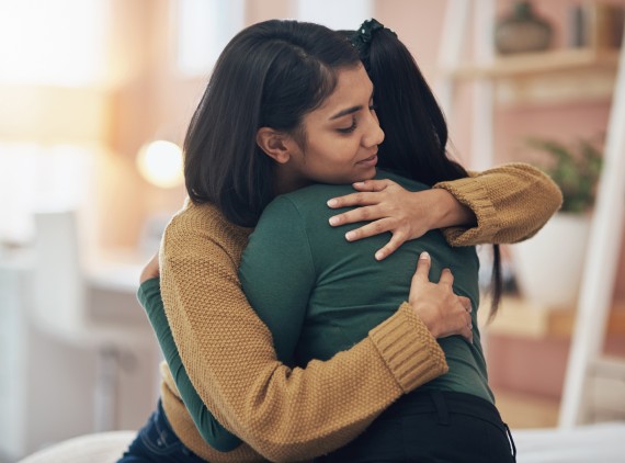 Two women hugging