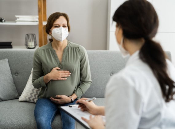 Pregnant woman meeting with provider