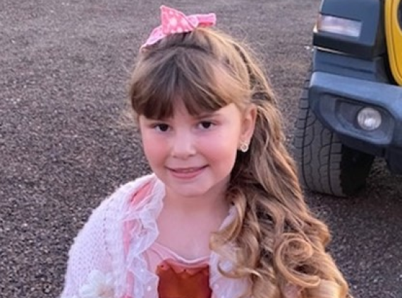 Girl in pink sweater