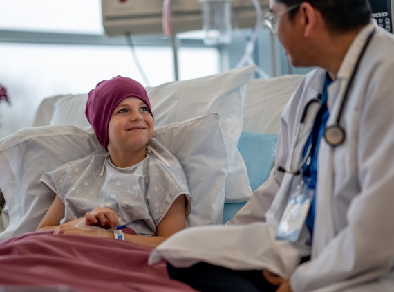 Doctor with child at bedside