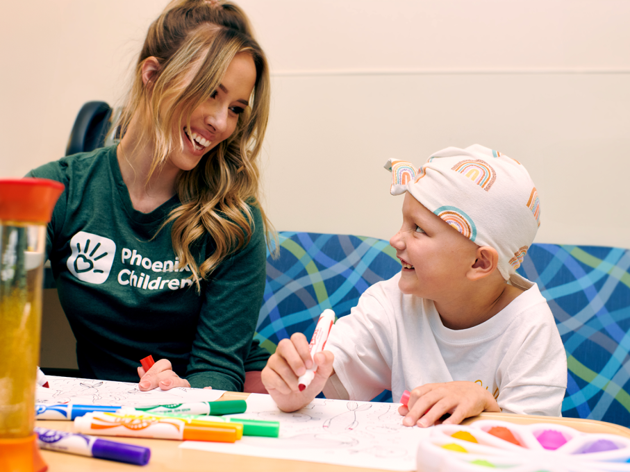 Child coloring with child life specialist