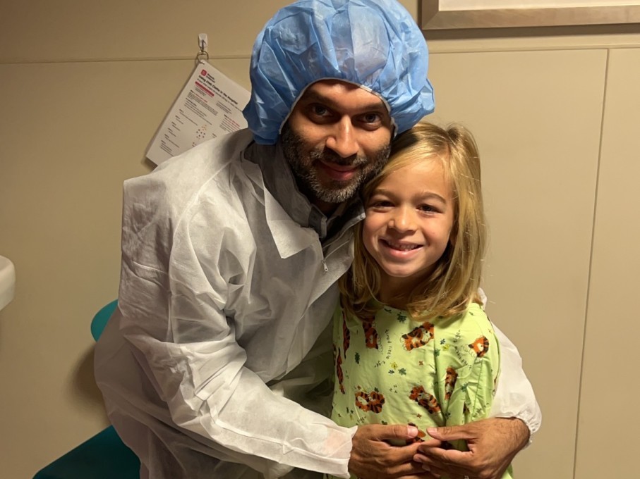 Boy and father smiling at hospital before surgery