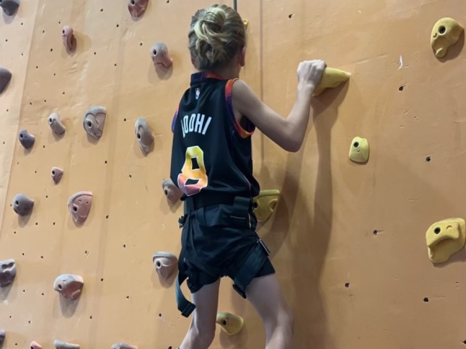 Boy rock climbing
