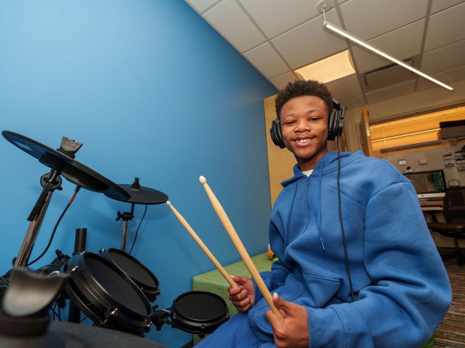 Boy playing the drums in The Zone