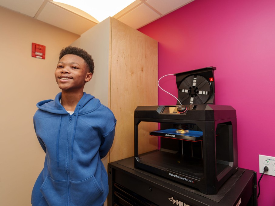 Boy using 3D printer in The Zone