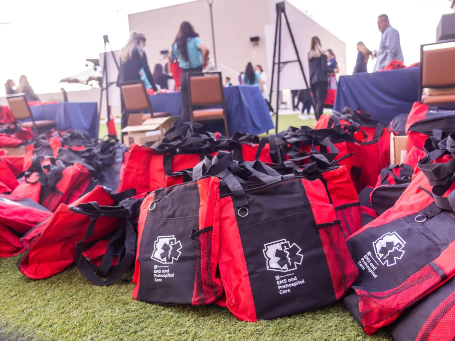 Red and black EMS branded tote bags