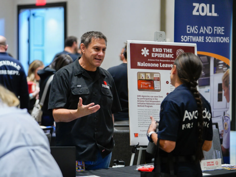 EMS attendee and Avondale firefighting talking at EMS conference