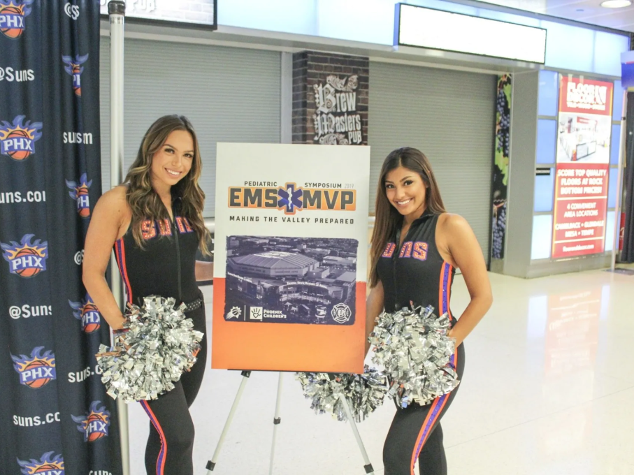 Phoenix Suns cheerleaders with EMS sign