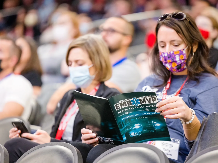 Woman reading program at EMS conference