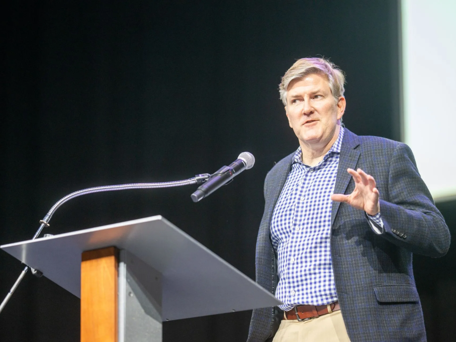 Man speaking at podium at EMS conference