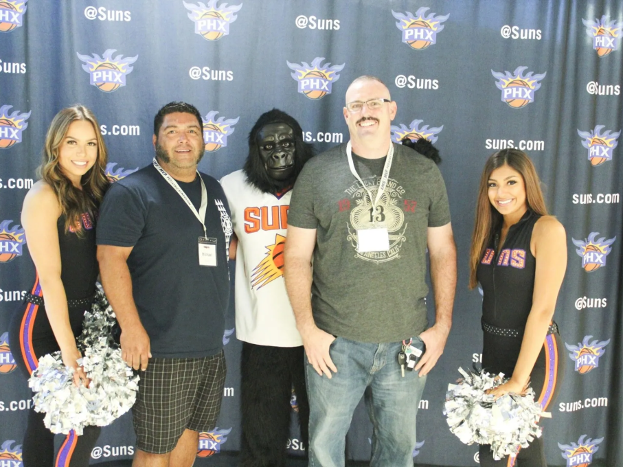 Attendees, Phoenix Suns mascot, and cheerleaders at EMS conference