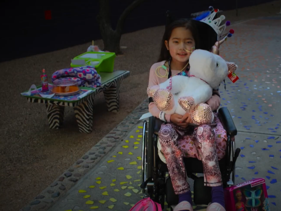 Girl holding stuffed animal