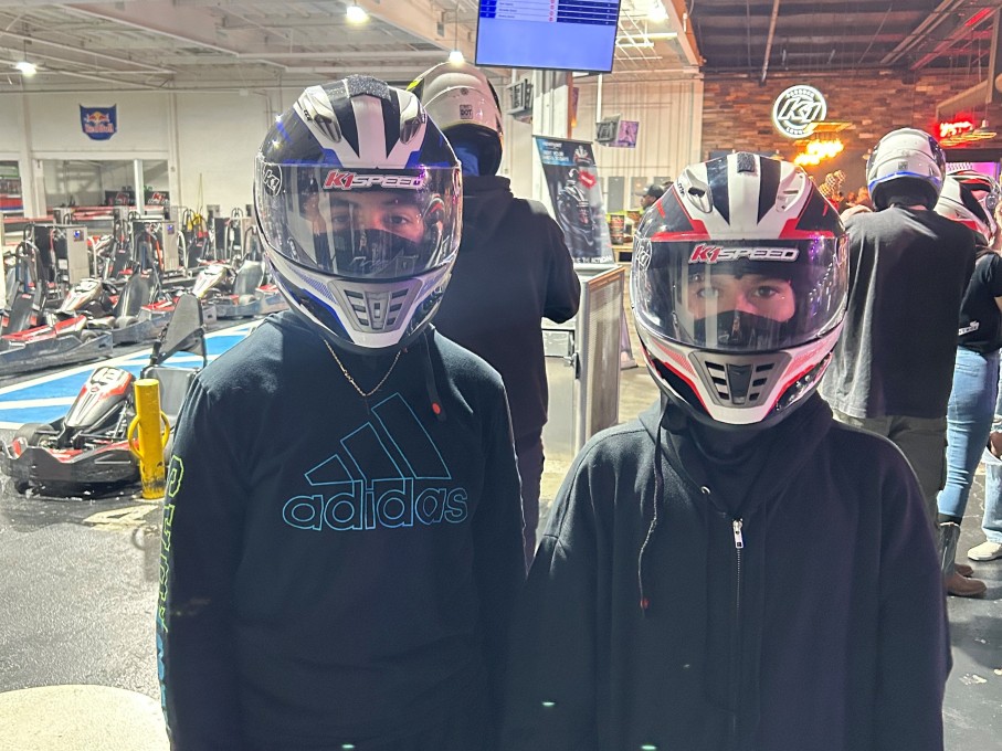 Two teens in bike helmets