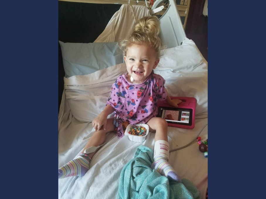 Toddler in hospital bed