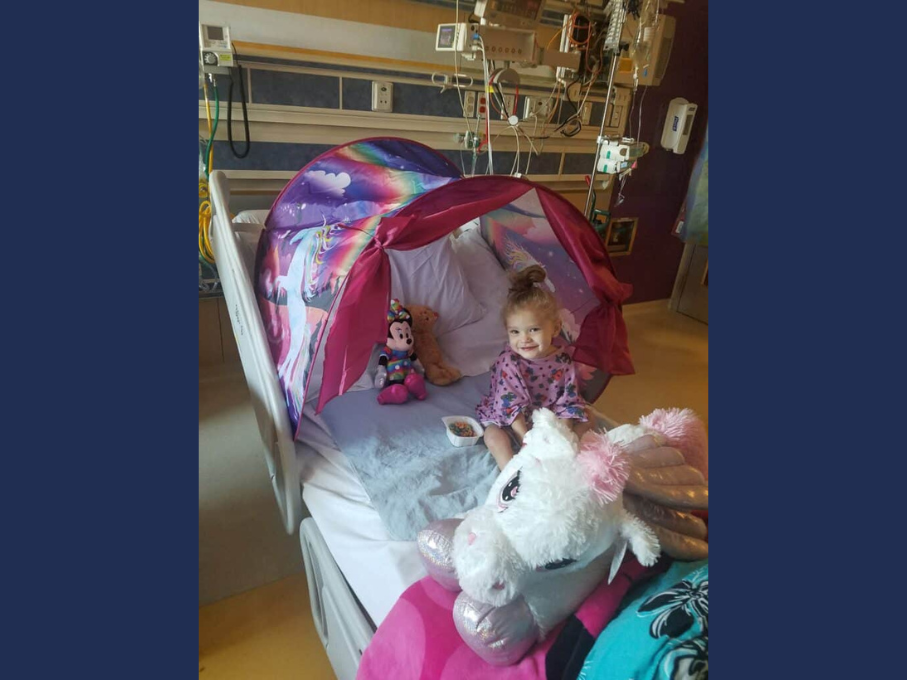 Toddler in hospital bed