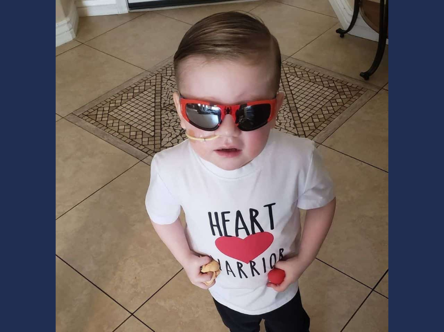 Toddler wearing red sunglasses