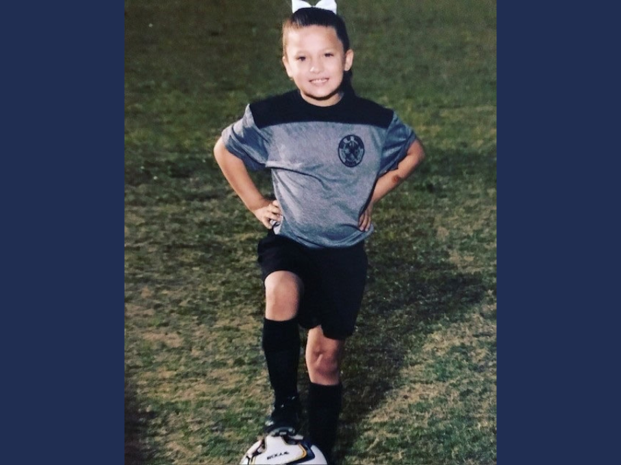 Girl posing with soccer ball