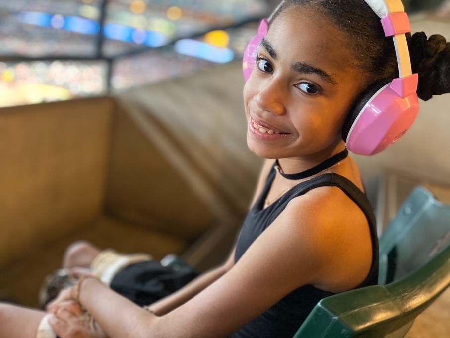 Girl wearing pink headphones