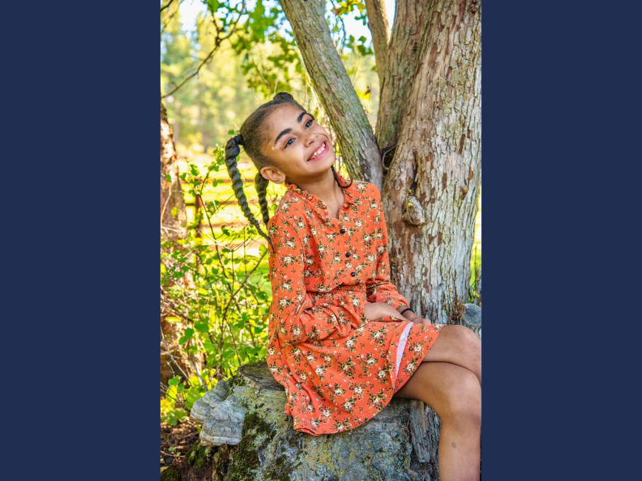 Girl sitting on rock