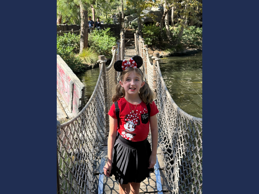 Girl standing on bridge