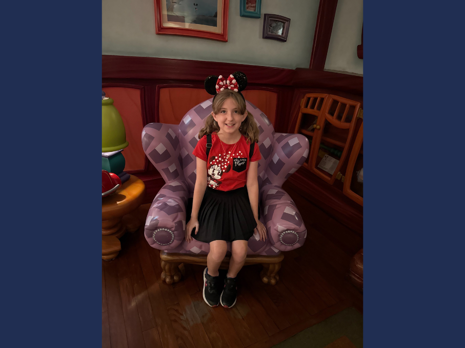 Girls sitting on stuffed chair