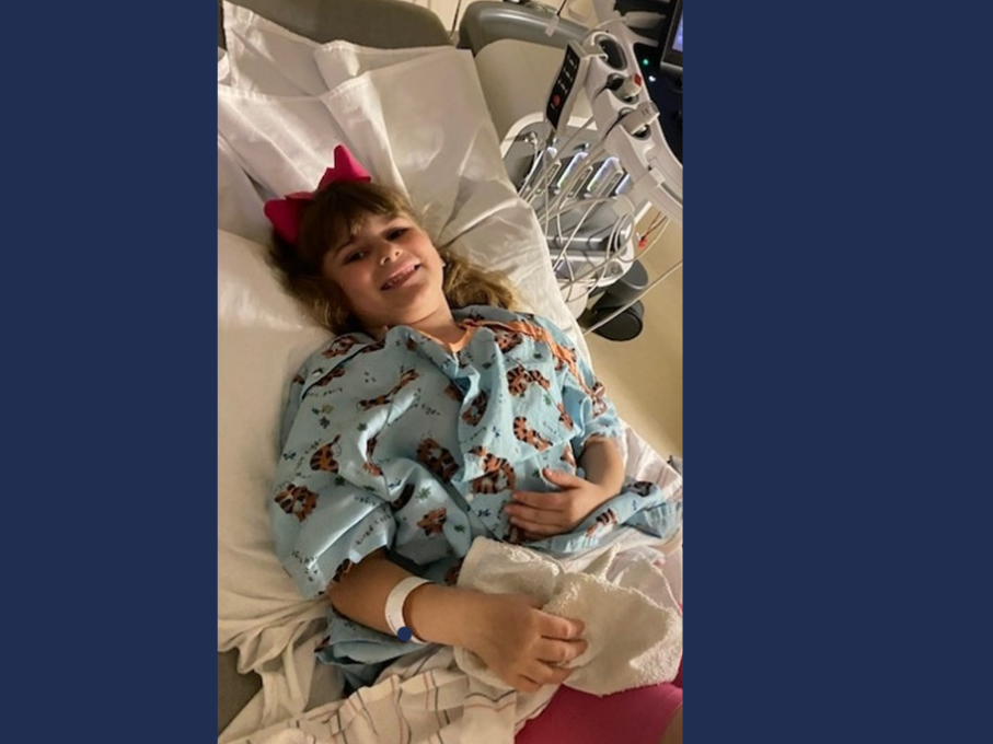 Girl in hospital bed