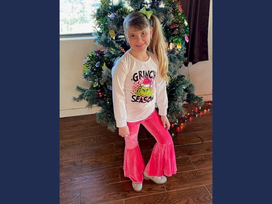 Girl in pink bell bottom pants