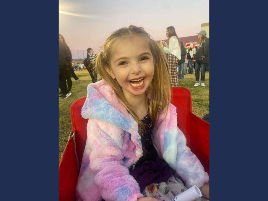 Girl laughing in a wagon