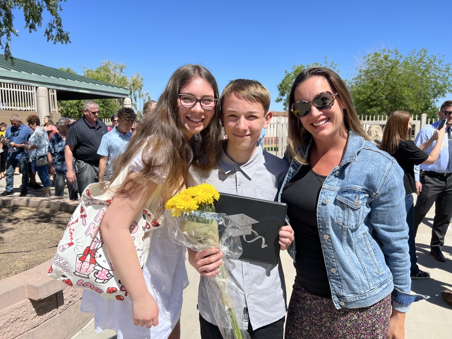 Family around teen graduate