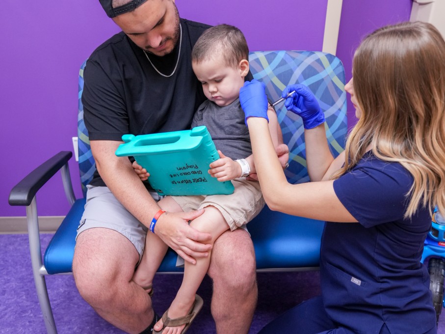 Child in parents lap with distraction