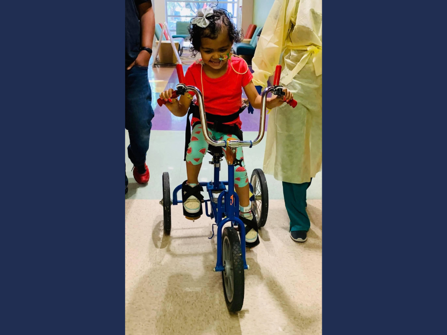 Child on therapy bicycle