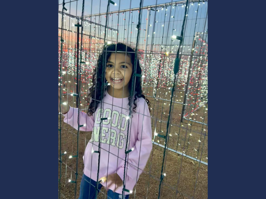 Girl posing with holiday lights