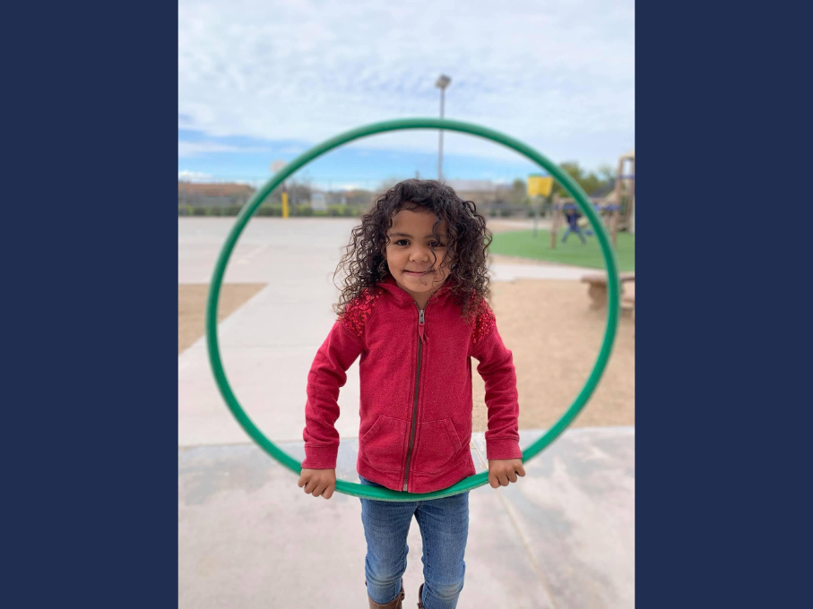 Girl posing with hula hoop