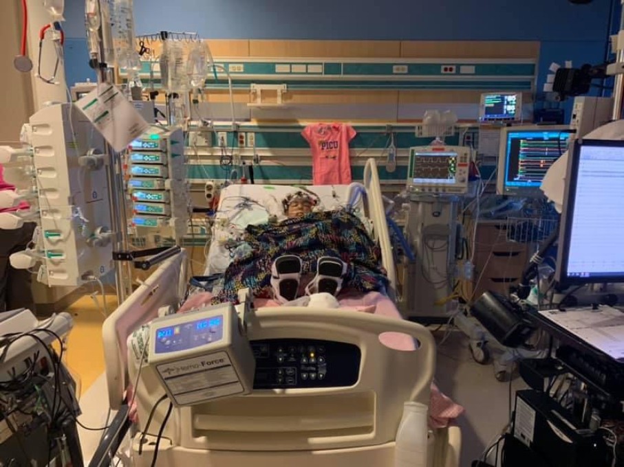 Toddler in hospital bed