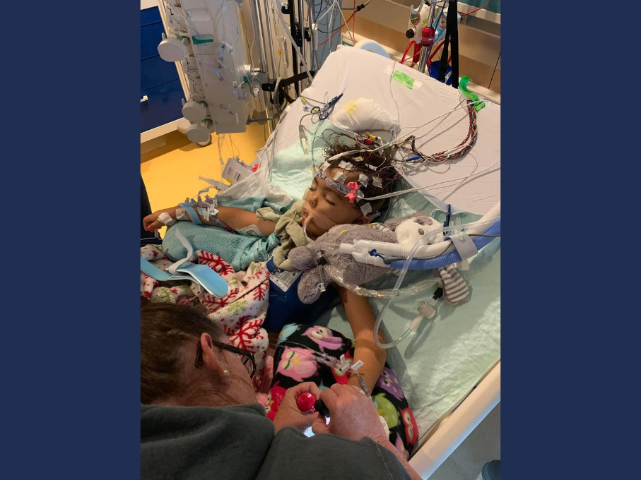 Toddler in hospital bed
