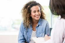 Young woman speaking to provider