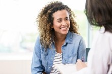 Young woman speaking to provider