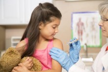 Young girl getting immunized