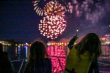 Children watching fireworks in distance