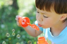 Child blowing bubbles