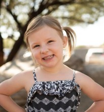 Young girl smiling at camera