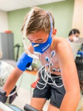 Boy wearing medical testing equipment