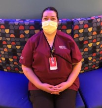 Masked provider sitting on bench