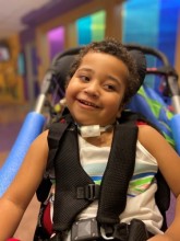 Smiling boy in stroller