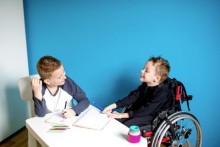 Two boys doing schoolwork