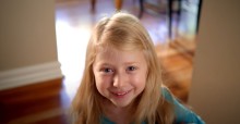 Young girl smiling at camera