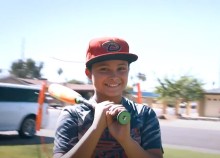 Boy with baseball bat on his shoulder